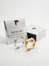 Gold and silver cufflinks with branded box on a white background