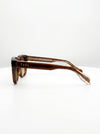 Sunglasses with a tortoiseshell frame on a white background