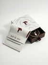 Jewelry box with a necklace and card on a white background