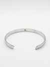 Silver bangle on a white background