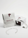 Silver bracelet with branded box on a white background