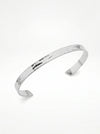 Silver bangle on a white background