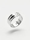 Silver ring with a subtle design on a light gray background