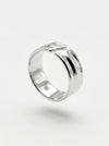 Silver ring on a light gray background