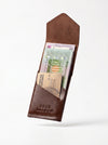 Brown leather wallet with American Express card and currency on a white background