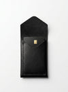 Black leather phone case with gold logo on a white background