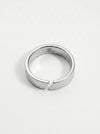 Silver ring with a unique design on a white background