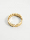 Gold ring with a unique design on a white background