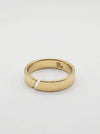 Gold ring with a brand logo on a light gray background